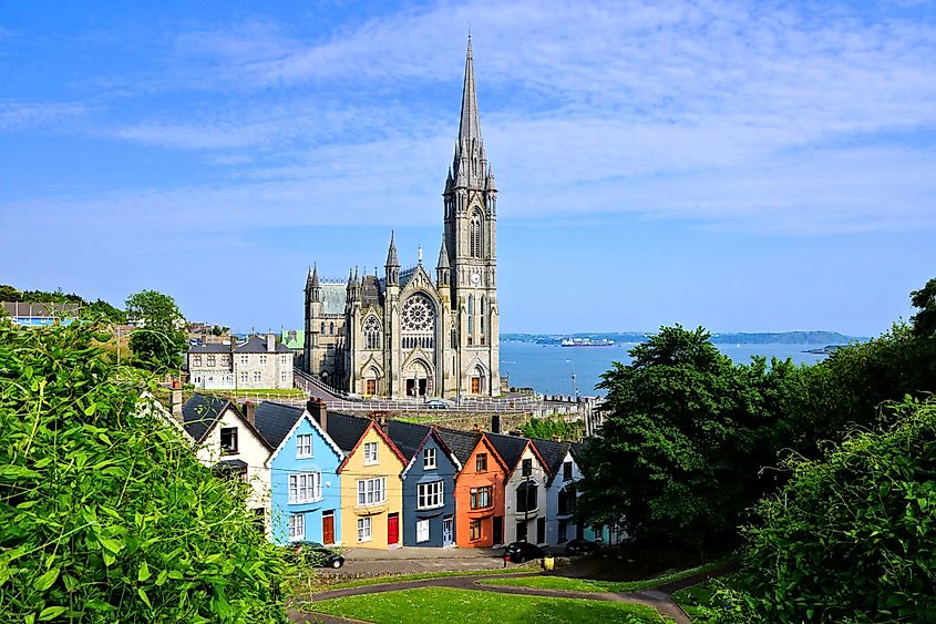 Colorful houses with cathedral in background in Cobh, County Cork, Ireland.