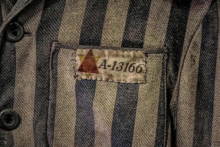 Dehumanization led to genocide of Holocaust Victims, through serial numbers on clothing as well as tattooed identification numbers. Image used under license from Shutterstock.com.