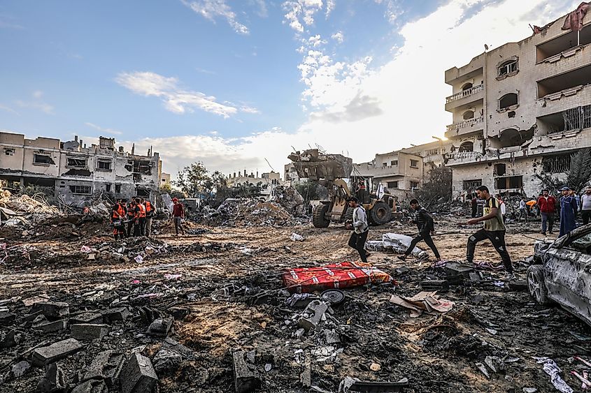The Palestinian Civil Defense searches for survivors after an Israeli raid in the city of Rafah. Image used under license from Shutterstock.com.