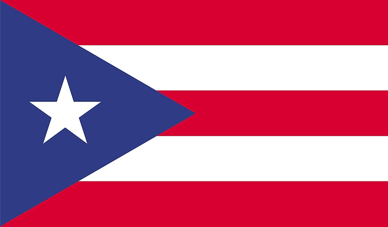 The National Flag of Puerto Rico features five equal horizontal bands of red (top, center, and bottom) alternating with white. A blue isosceles triangle based on the hoist side bears a large, white, five-pointed star in the center. 