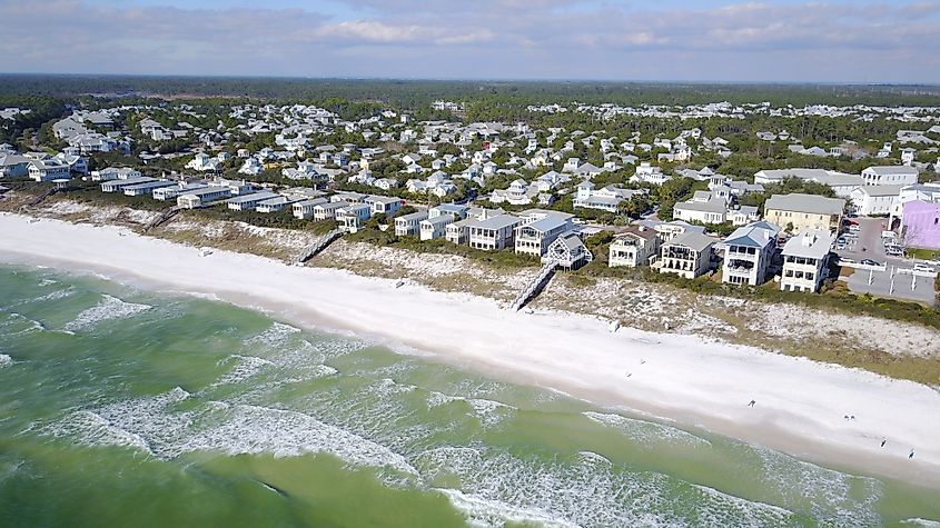 Aerial view of beachfront homes in Seaside, Florida, seen from the Gulf of Mexico.