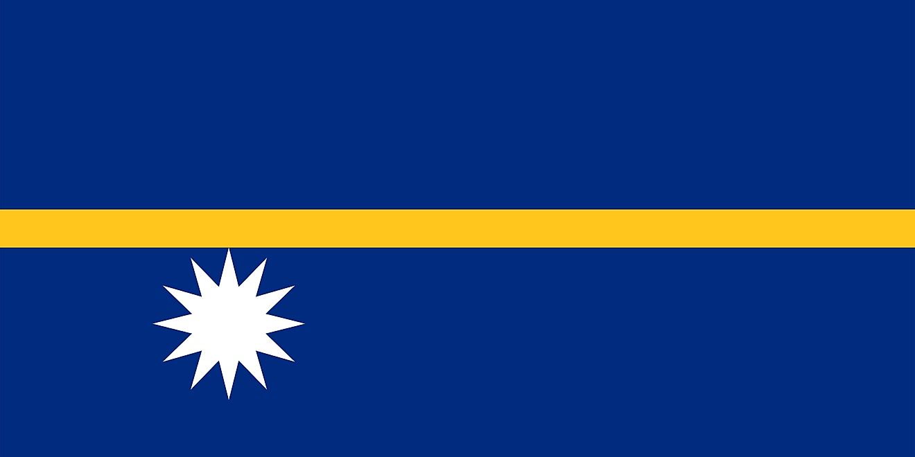 The National Flag of Nauru features a blue background with a narrow, horizontal gold stripe and a white star in the lower hoist side