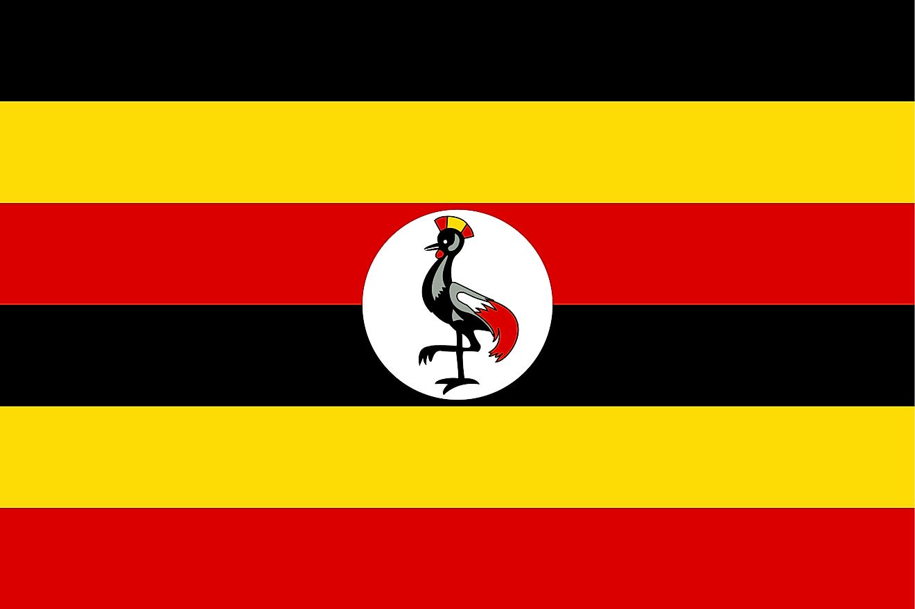 The National Flag of Uganda features six equal horizontal bands of black (top), yellow, red, black, yellow, and red. The flag also includes a white disc superimposed at the center, which is featuring a grey-crowned crane, facing the hoist side of the flag