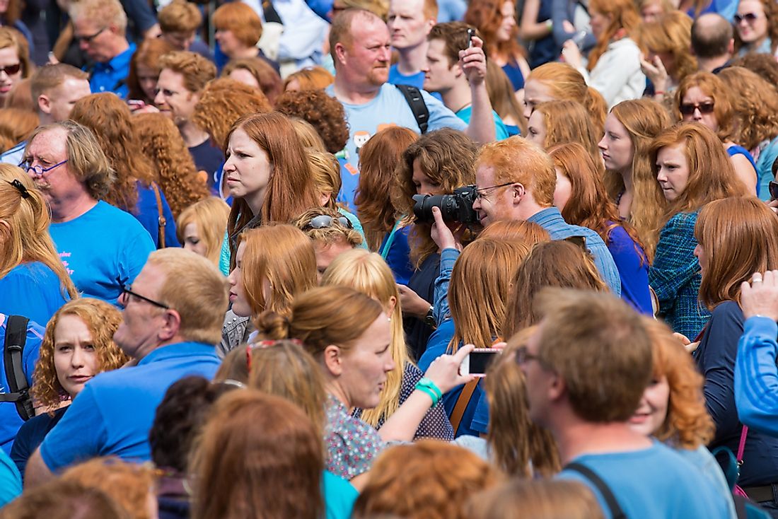 A crowd of people seen during "red head day" in the Netherlands. Editorial credit: Rob van Esch / Shutterstock.com.