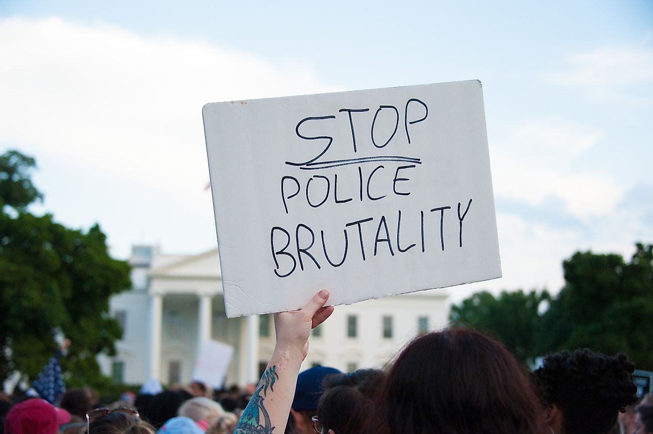 A sign held at a march against police brutality and racism in front of the White House in Washington, DC on July 7, 2016. Image credit: Rena Schild/Shutterstock.com