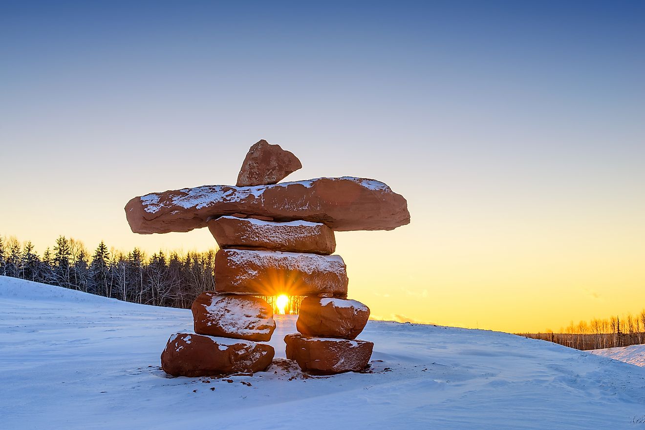 Inukshuk with dusting of snow at sunset. Image credit: Smcfeeters/Shutterstock.com
