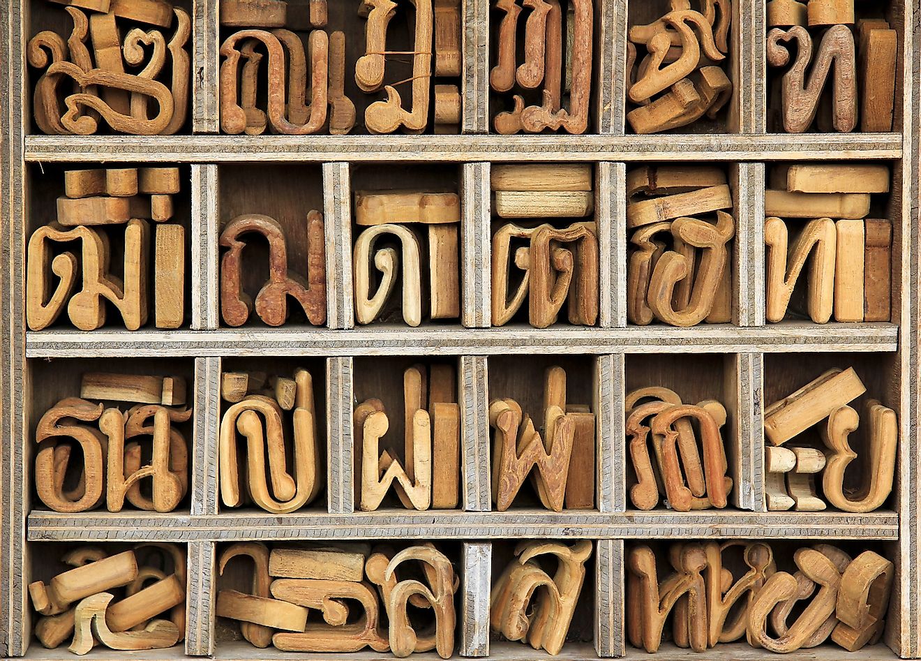 Thai language alphabet wooden blocks at a carpenter's studio in Thailand. Image credit: Shutterstock.com