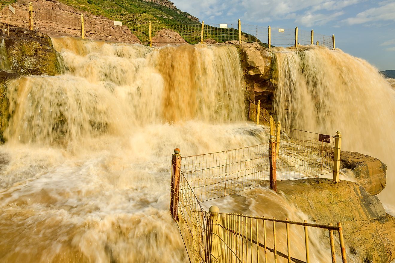 The Hukou Waterfall along China's Yellow River is the world's largest yellow waterfall.