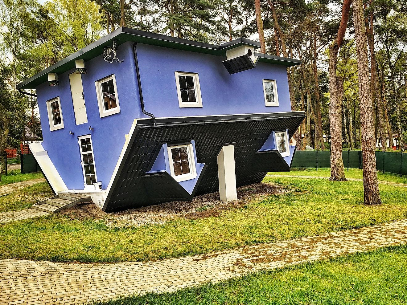 Upside-down houses often make visitors feel dizzy and disoriented. Editorial credit: Fotokon / Shutterstock.com