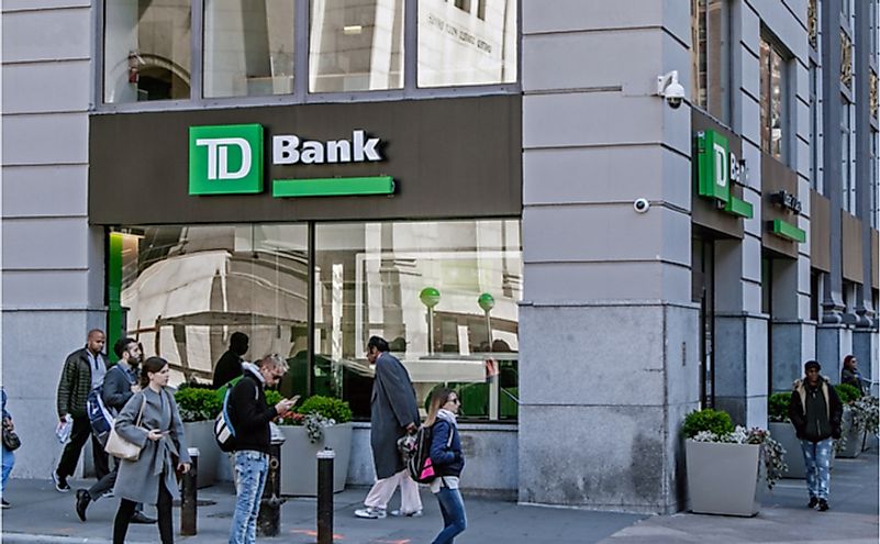 People walk by a TD Bank retail location in Manhattan. Editorial credit: Roman Tiraspolsky / Shutterstock.com