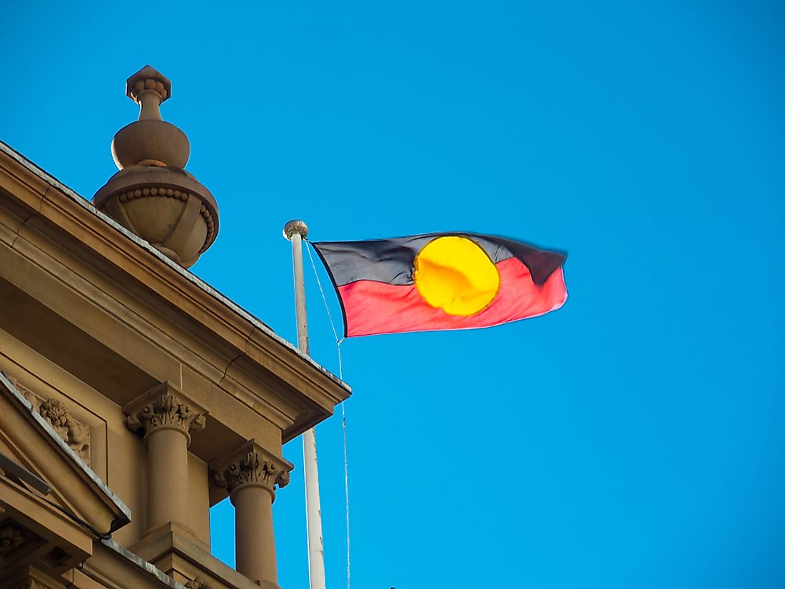 The Australian Aboriginal flag flying at Sydney City Hall. Editorial credit: ArliftAtoz2205 / Shutterstock.com.