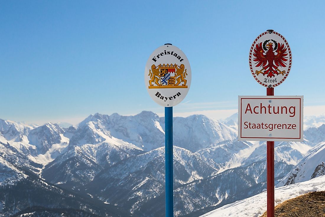 Signs marking the boundary between Bavaria in Germany and Tyrol in Austria. 