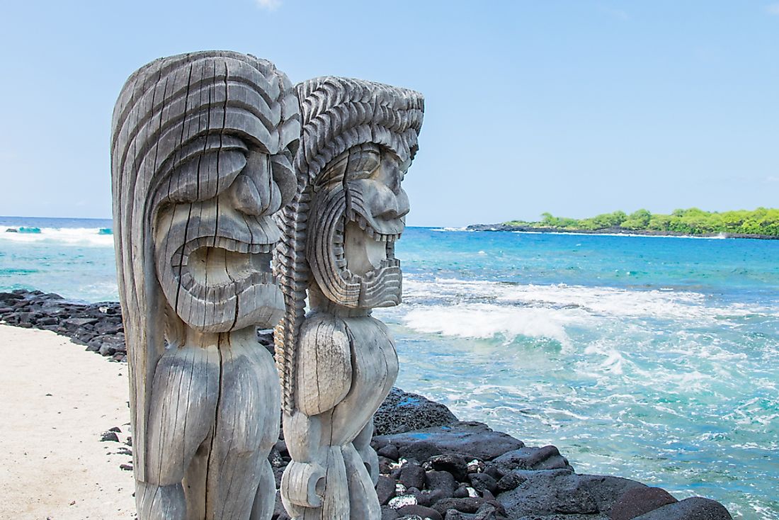 Polynesian carvings on a beach. 