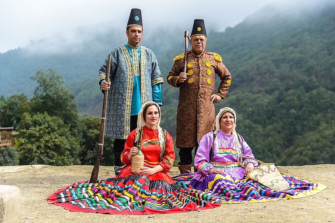 Men and women wear traditional clothing during Eid al-Adha celebrations. Editorial credit: Jakob Fischer / Shutterstock.com.