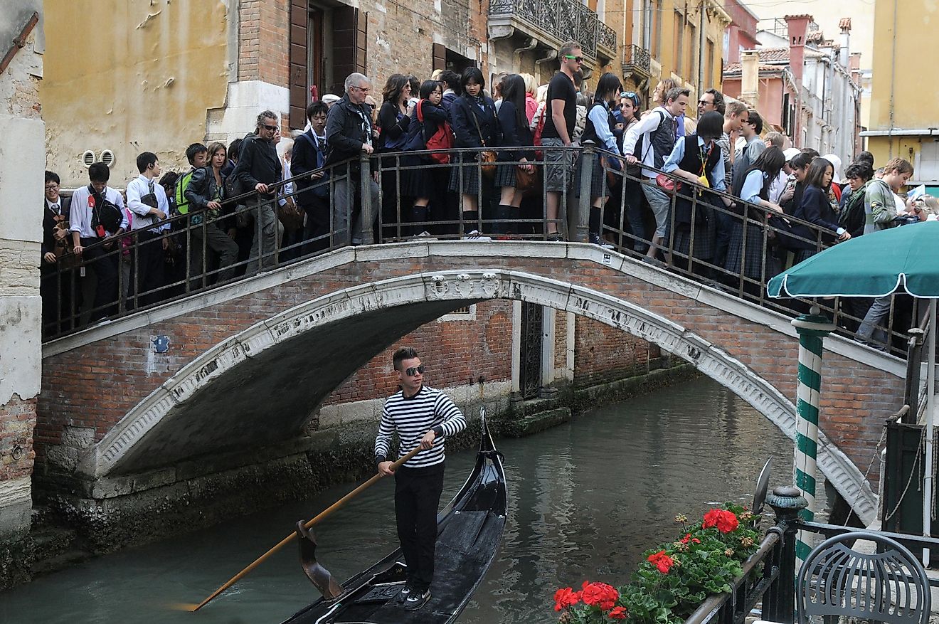A bridge in Venice overcrowded with tourists.