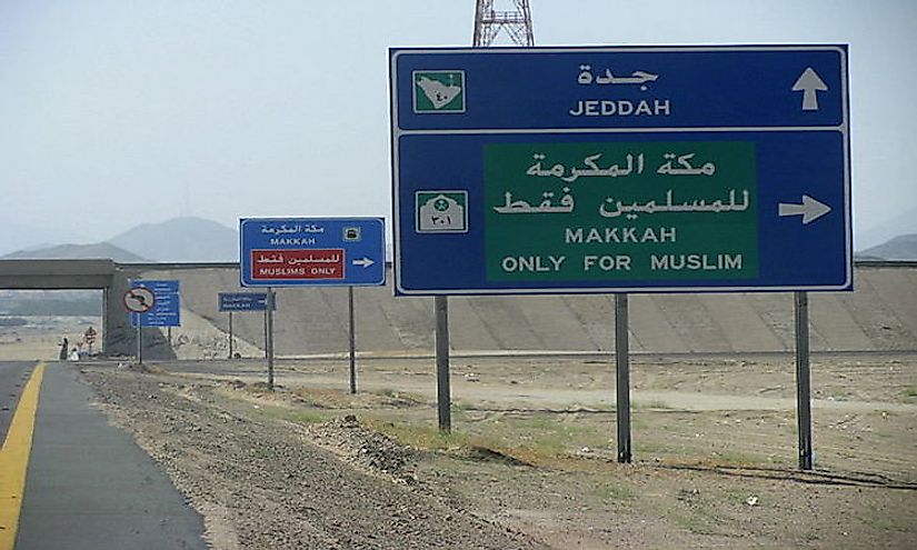 Road signs in Saudi Arabia in Arabic and English.