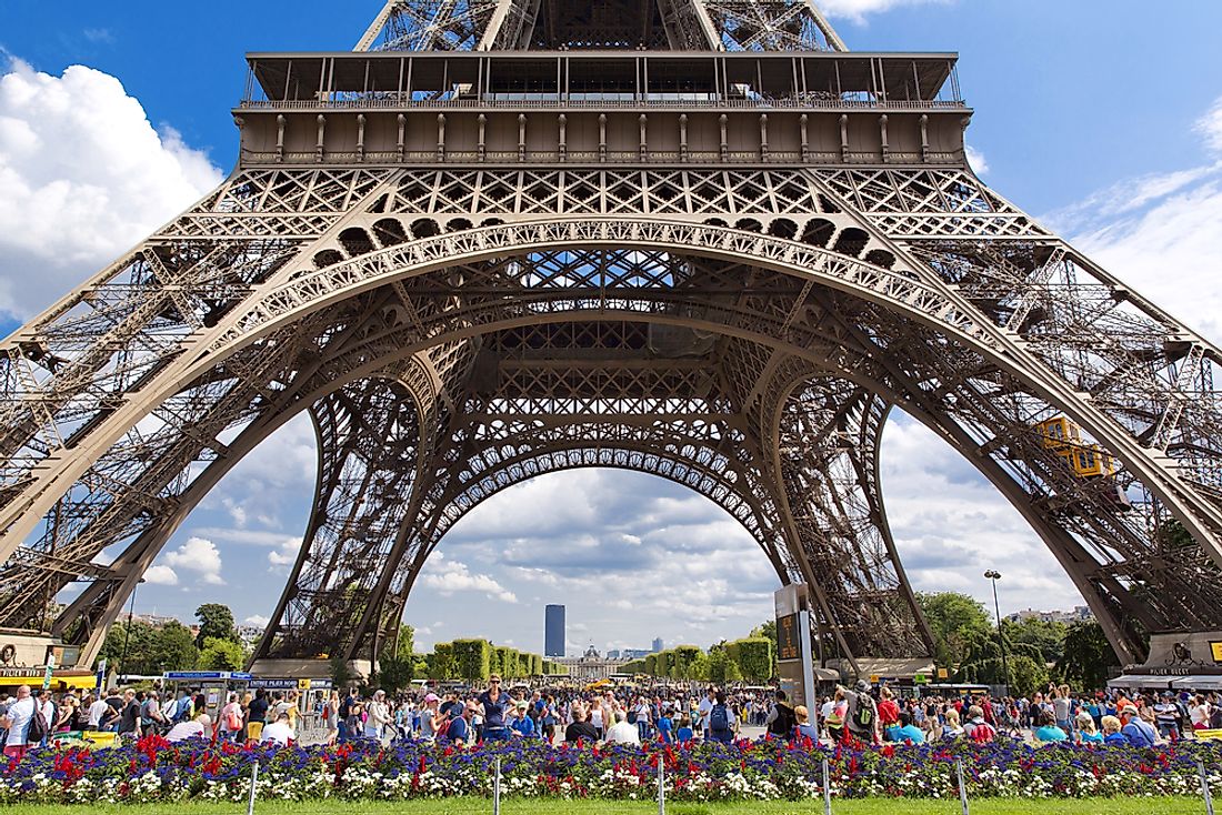 Tourists flock to the Eiffel Tower  in Paris, France. Editorial credit: lapas77 / Shutterstock.com