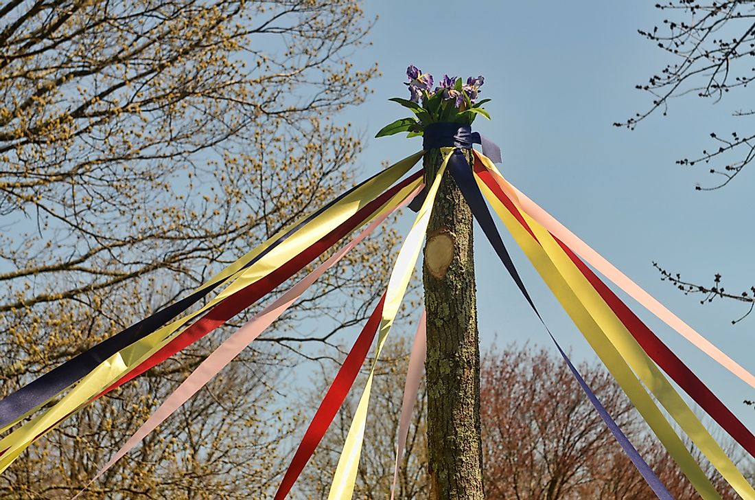 In the UK, May Day is traditionally celebrated by dancing around a maypole.