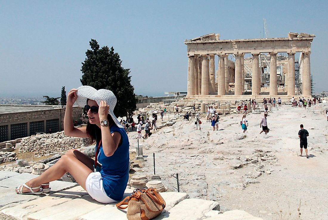 Tourists brave the heat to view the Acropolis in Athens, Greece, Europe's hottest city. Editorial credit: Alexandros Michailidis / Shutterstock.com.
