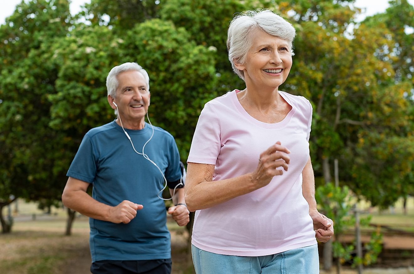 An aged couple running to stay fit and healthy.