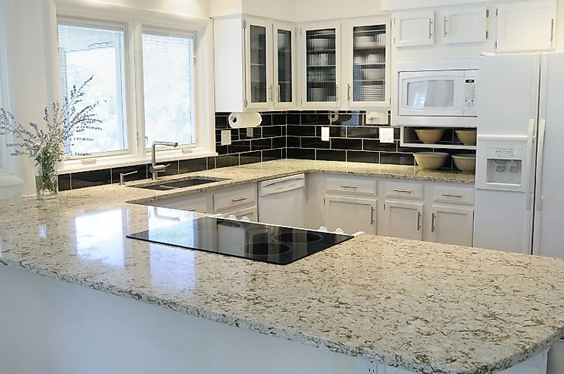 The beautiful granite countertops serve as the centerpiece of this kitchen.
