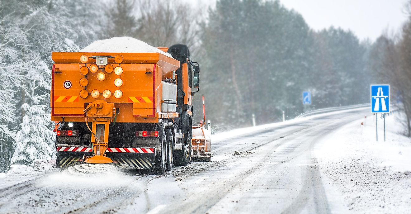 Road salt being added on a highway by a truck. Image credit: Krasula/Shutterstock.com