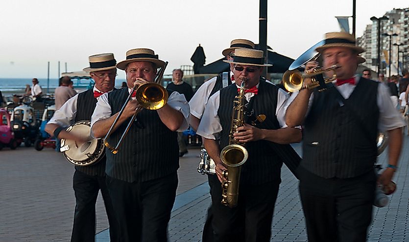  Jazz music being played by a walking group of musicians.