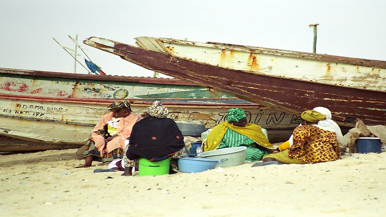 Local women clean fish at the beach in Nouakchott, Mauritania.