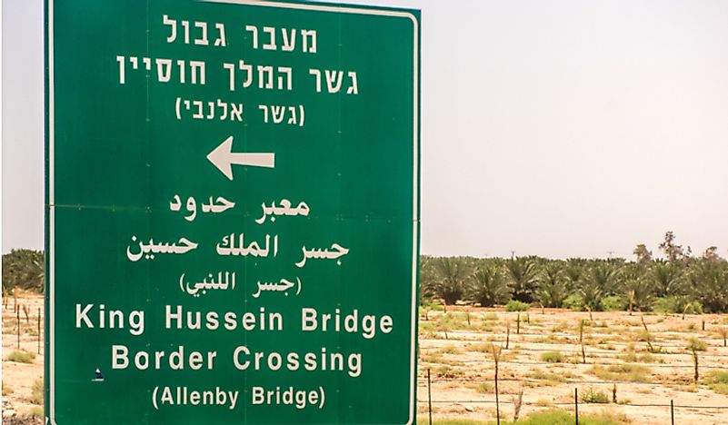 A sign advertising the border crossing between Israel and Jordan. Editorial credit: Brian Maudsley / Shutterstock.com.
