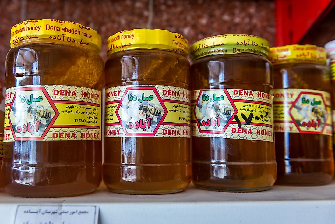 Honey on the shelf of a grocery store in Iran. Honey is consumed all over the world. Editorial credit: Fotokon / Shutterstock.com.