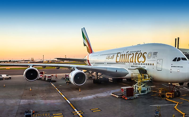 An Emirates Airbus A380-800 super jumbo, the largest passenger aircraft in the world is waiting for passengers and loading at London Heathrow terminal.
