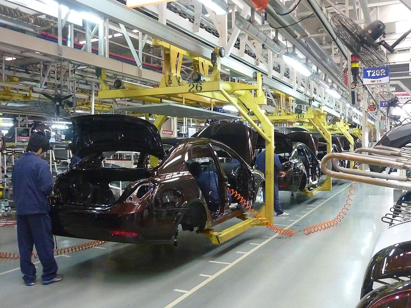A car being assembled in a motor-vehicle factory.