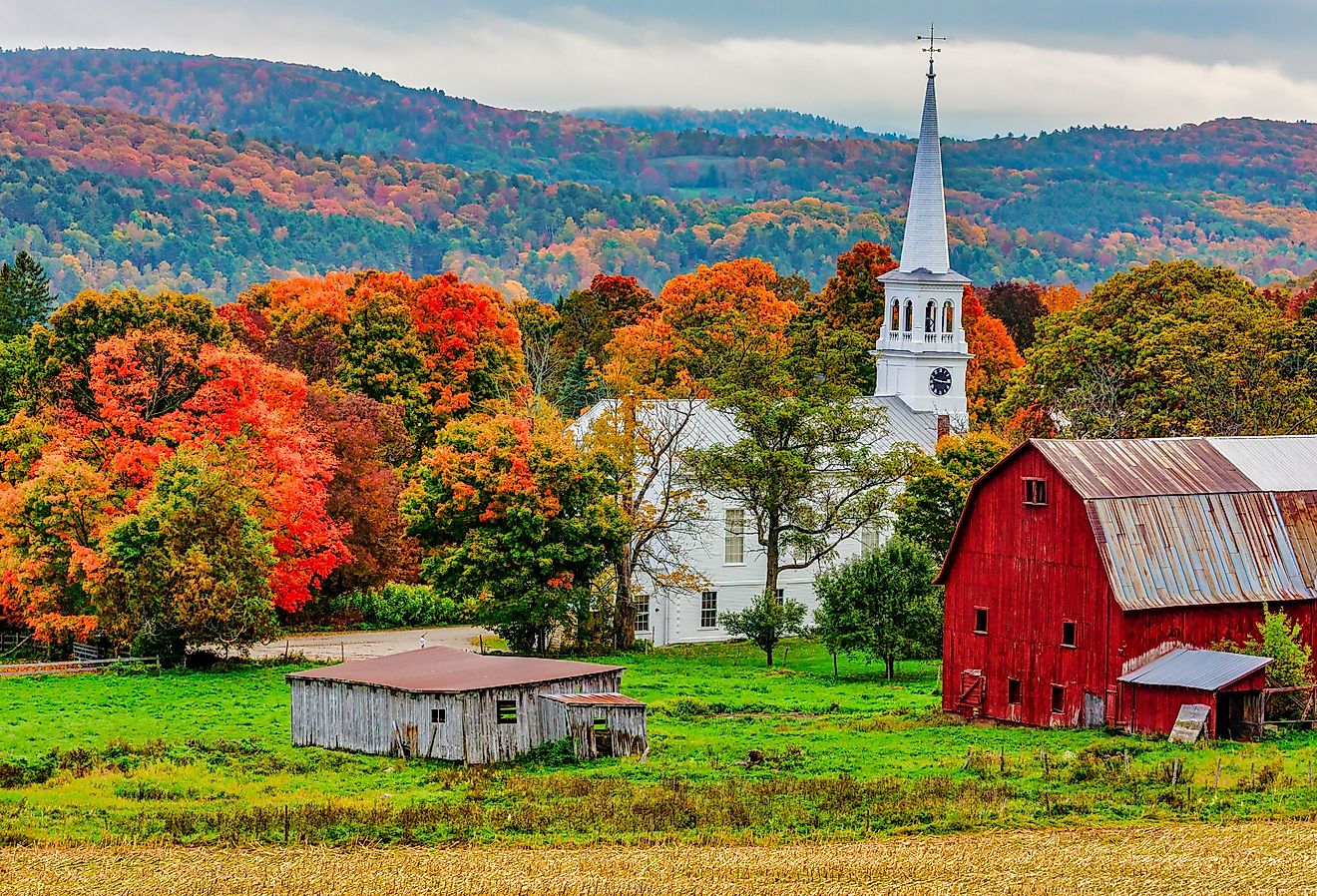 Red barn and church in Woodstock, Vermont. Image credit MindStorm via Shutterstock