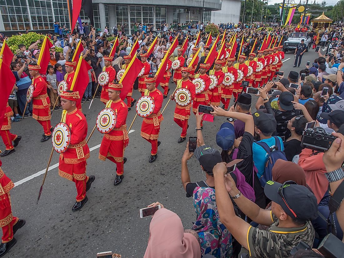 Onlookers watch as celebrations honor His Majesty 50 Years Golden Jubilee in Brunei. Editorial credit: james wk / Shutterstock.com.