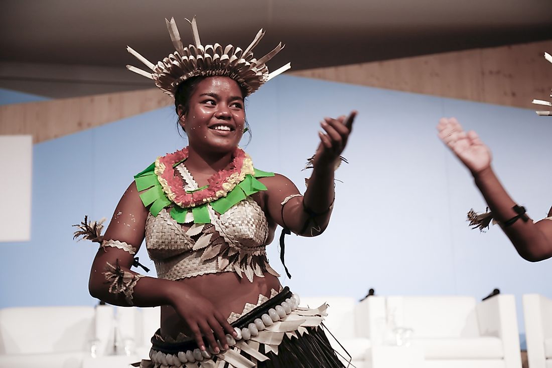A dancer from Kiribati performs at the UN Convention for Climate Change. Editorial credit: dominika zarzycka / Shutterstock.com.