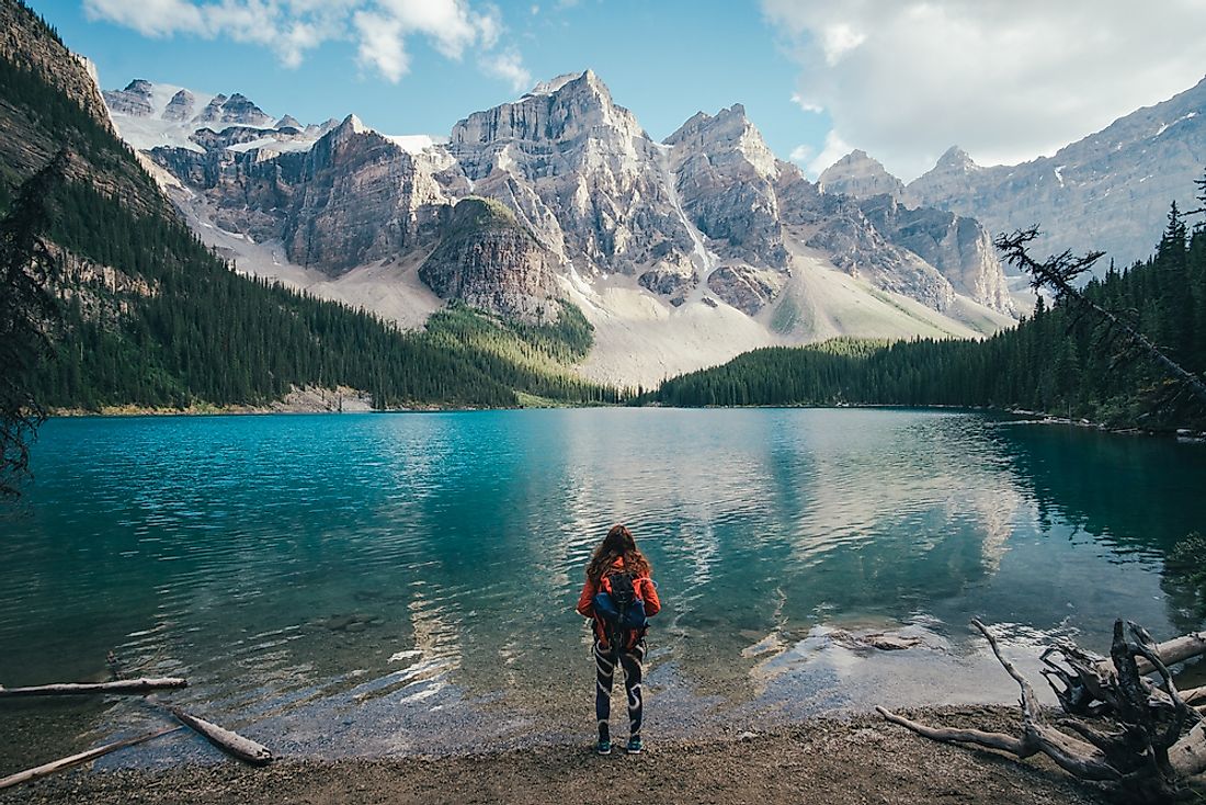 A backpacker admires the sights of Moraine Lake in Alberta, Canada. 