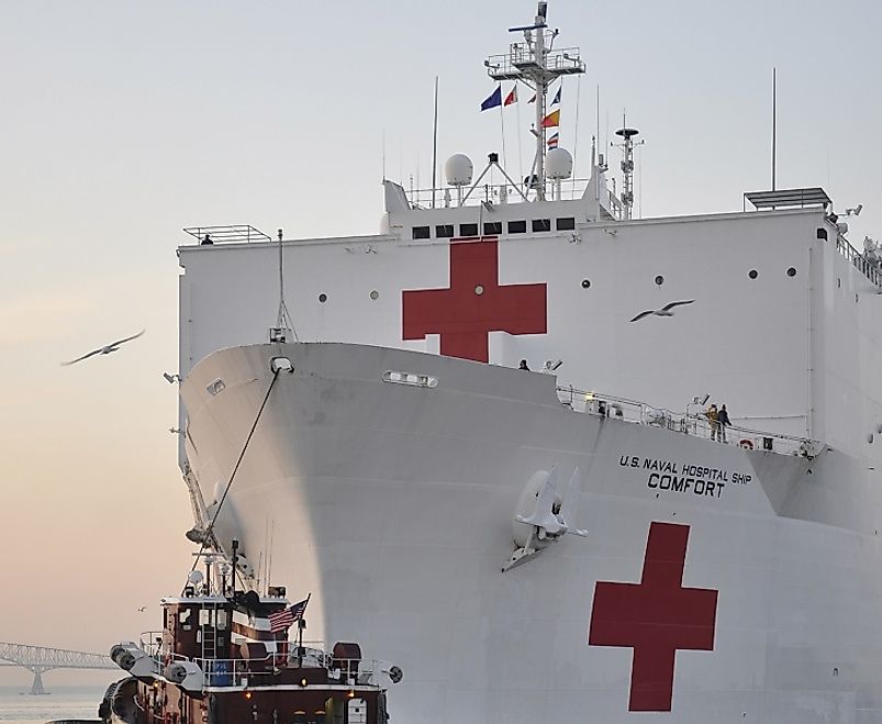 The USNS Comfort, a hospital and humanitarian aid ship displaying the Red Cross emblem upon its hull in Baltimore Harbor in the U.S. state of Maryland.
