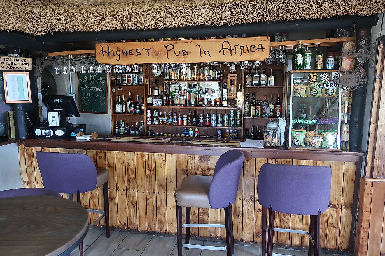 The bar of the "Highest Pub in Africa" with empty stools in the Lesotho mountains. Image credit: A. Mertens/Shutterstock.com