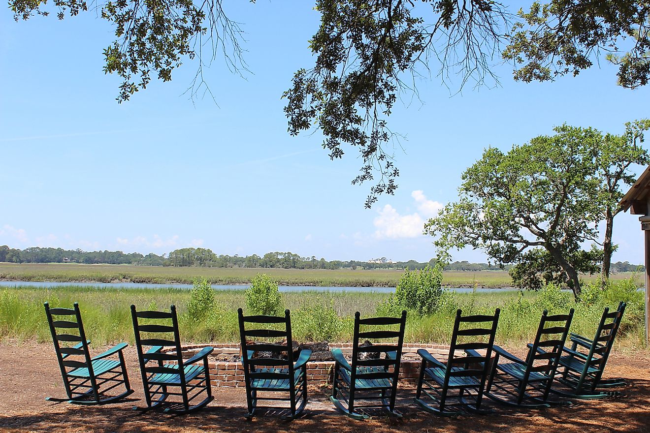 Rocking chairs around a bonfire looking over the marsh in South Carolina outside of Charleston.