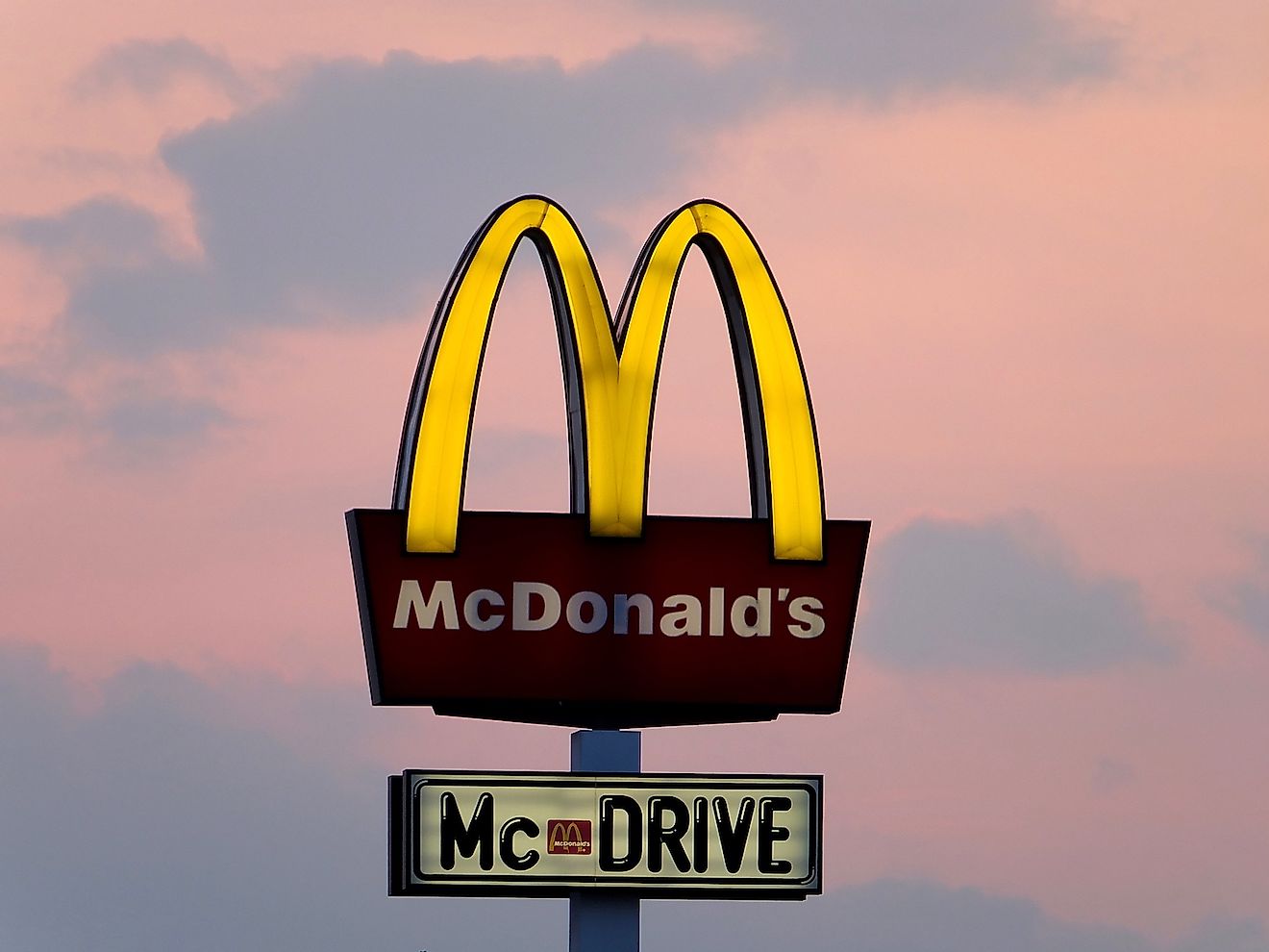 Neon of Mc Donald's in Szczecin, Poland. Mc Donald's is the largest and the most popular restaurant chain in Poland. Image credit:  siekierski.photo/Shutterstock.com