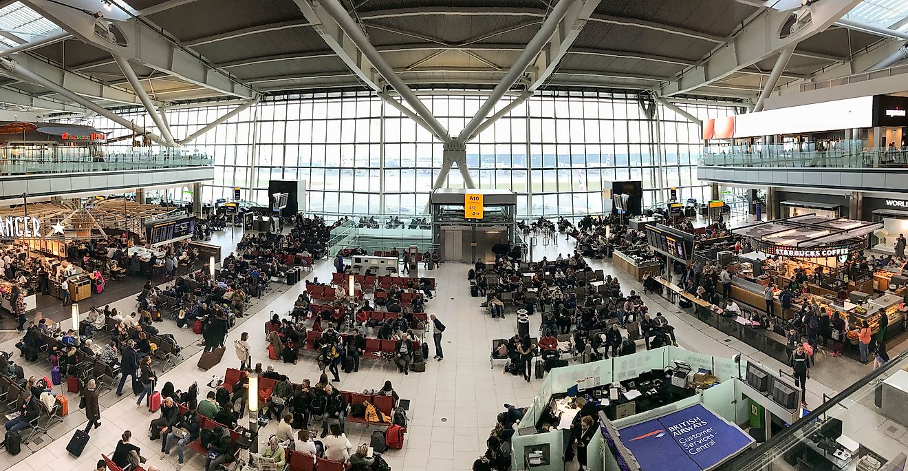 Passengers waiting at the Heathrow Airport, United Kingdom. It is the world's 7th busiest airport. Editorial credit: Ceri Breeze / Shutterstock.com