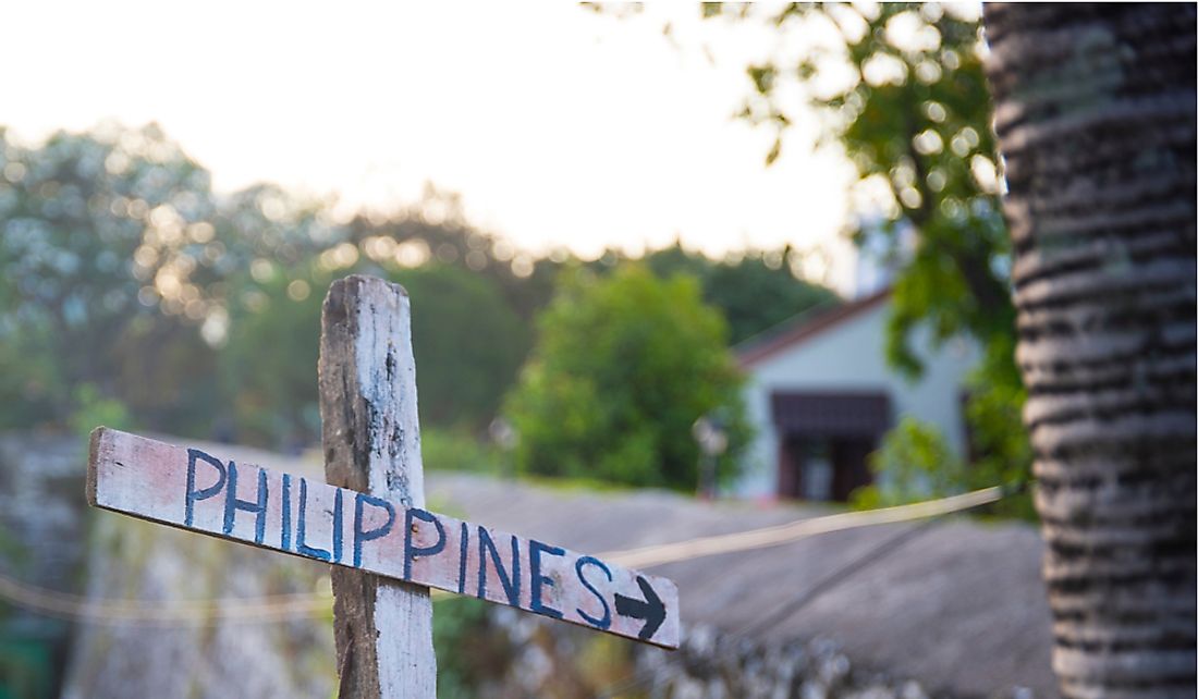 Signpost pointing towards the Philippines.