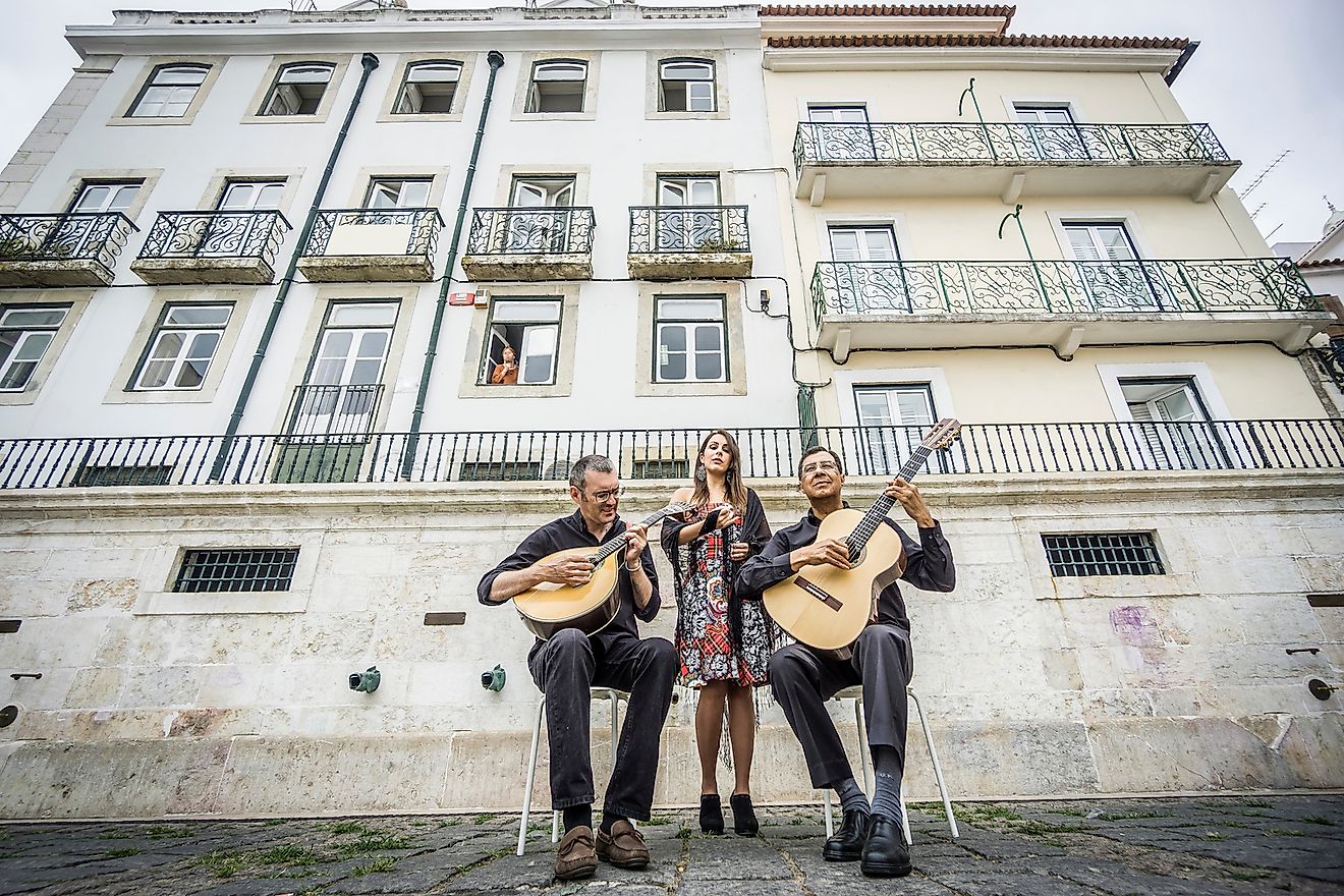 Fado band performing traditional Portuguese music on the square of Alfama, Lisbon, Portugal. Image credit: Sopotnicki/Shutterstock.com