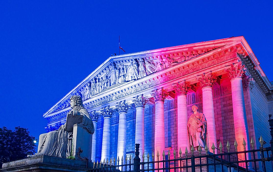 The National Assembly in France lit up in the colors of the French flag. 