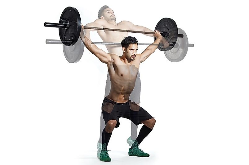 A man performs a Snatch, currently one of the two competitive lifts, alongside the Clean and Jerk.