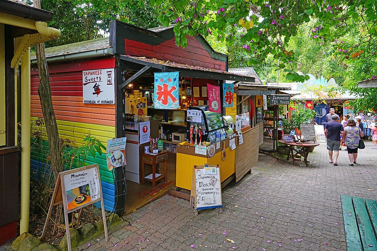 The original Kuranda Rainforest Market is a folk art and food market located in the rainforest village of Kuranda near Cairns in Far North Queensland, Australia, via EQRoy / Shutterstock.com