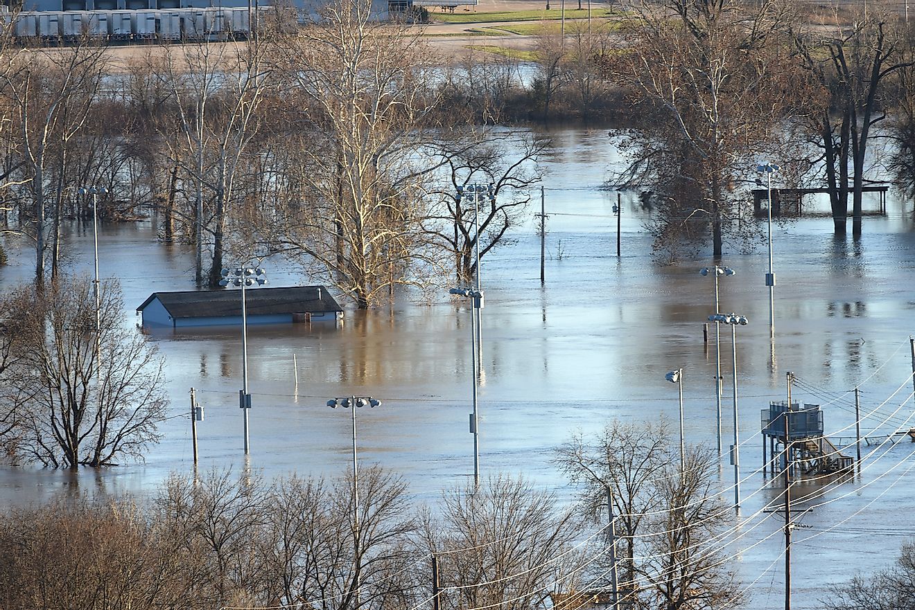 Flood waters nearly submerge house in Valley Park in old town Fenton, Valley Park, Missouri. Image credit: Gino Santa Maria/Shutterstock.com