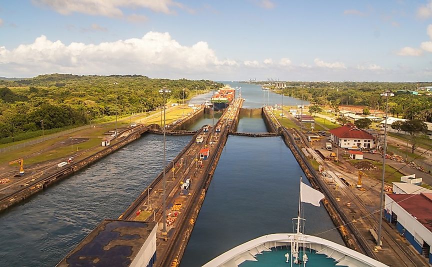 A cargo ship passes through updated locks along the modern-day Panama Canal.