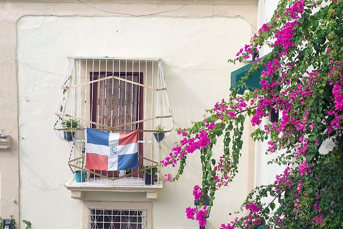 A balcony bearing the flag of the Dominican Republic. 