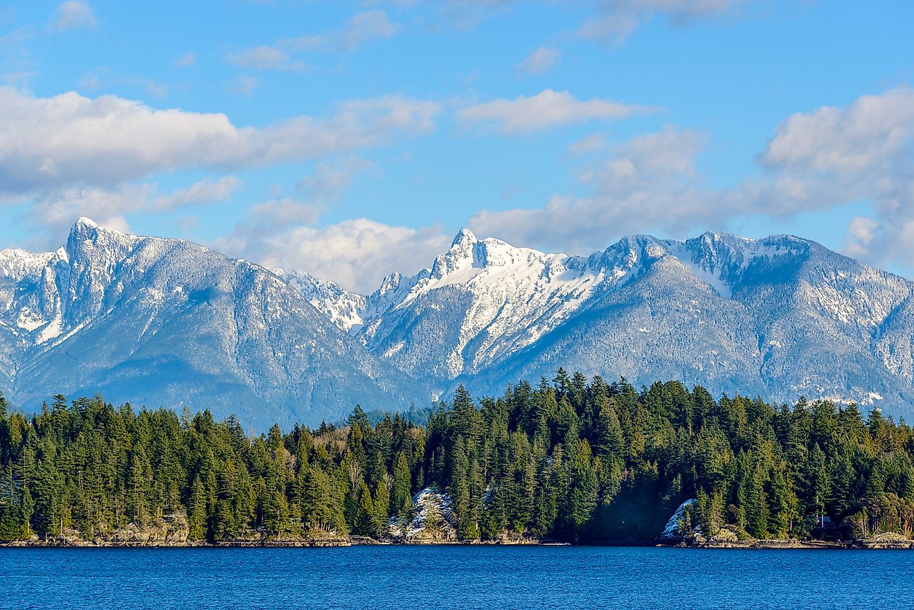 Snow mountain and rocks at Sechelt inlet in Vancouver, Canada. Image credit: karamysh/Shutterstock.com